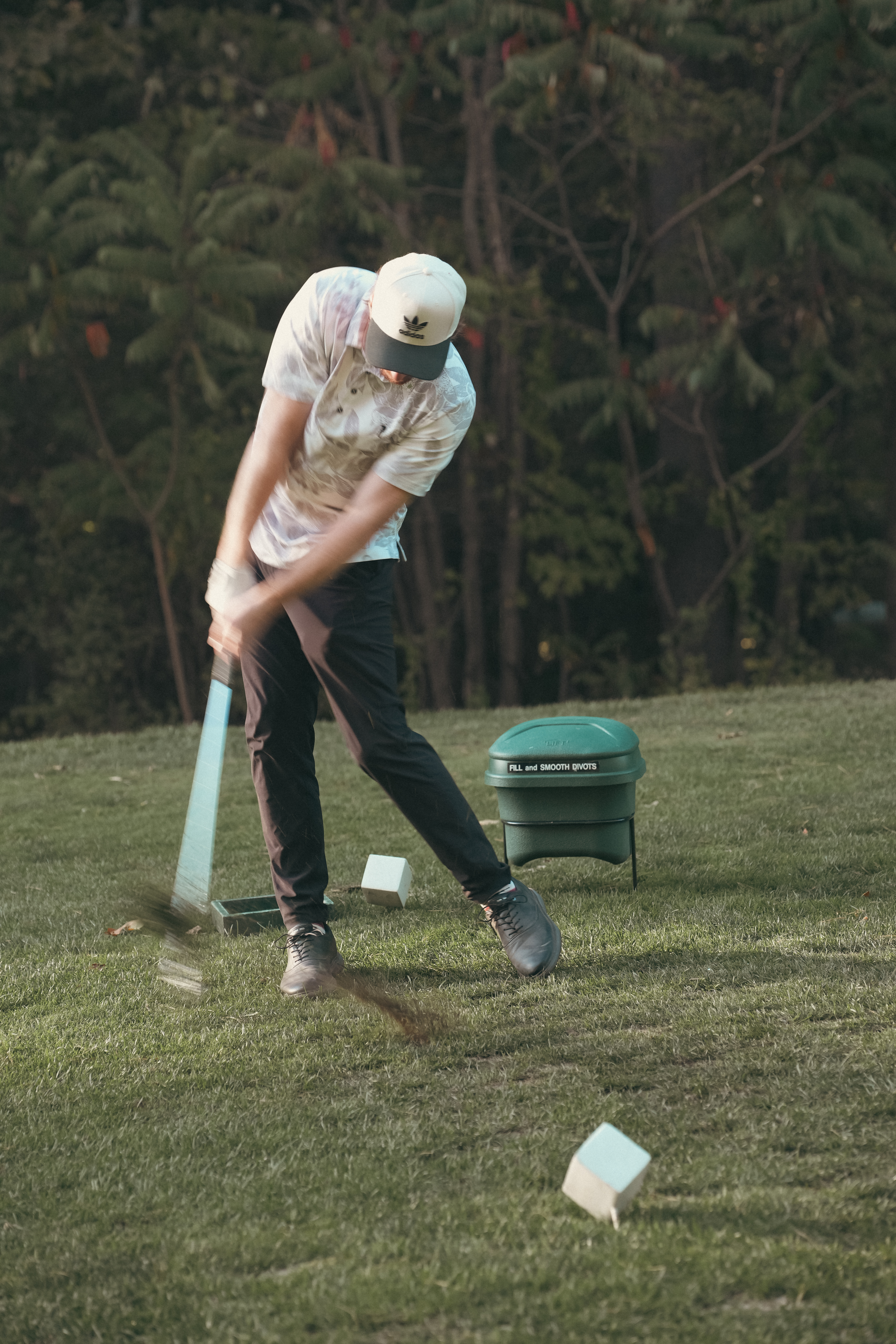 Cory Goulet on a golf course at golden hour.